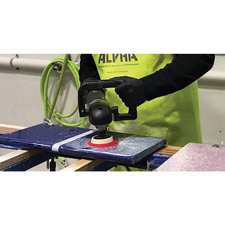 Contractor resurfacing an engineered stone countertop using the BMP Quartz Resurfacing Kit color-coded polishing system