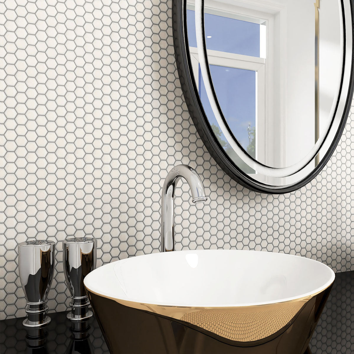 Modern bathroom with hexagonal tile pattern, freestanding bathtub, and round mirror.