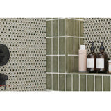 Bathroom setting with Hexagon Porcelain Mosaic Tile - Sage Green and shelves holding skincare products.