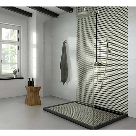 Modern shower area with Penny Round Porcelain Mosaic Tile - Sage Green and wooden stool in a bathroom.