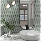 Bathroom interior with a round white sink, Penny Round Porcelain Mosaic Tile - Tropical Lush and a large mirror.