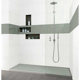 Modern shower setup with Penny Round Porcelain Mosaic Tile - Tropical Lush and a shower head.