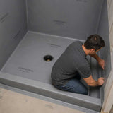 Installing Composeal 40 mil waterpoofing vinyl gray on a shower base with