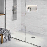 Modern bathroom with glass shower enclosure, White wall tiles, and Polished Chrome fixtures with Ebbe Drains Unique Square Shower Drain Grate - Lattice