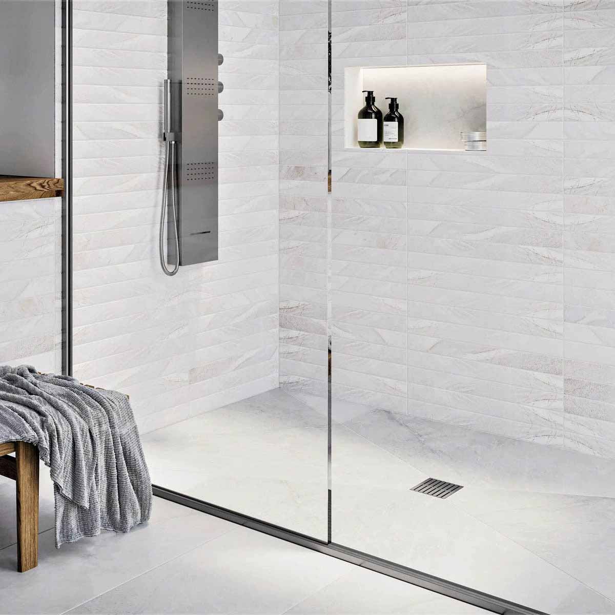 Modern bathroom with glass shower enclosure, White wall tiles, and Brushed Nickel fixtures with Ebbe Drains Unique Square Shower Drain Grate - Parallel