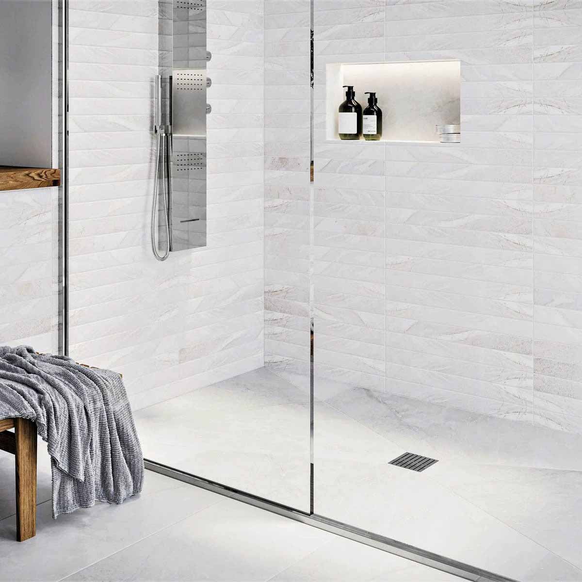 Modern bathroom with glass shower enclosure, White wall tiles, and Polished Chrome fixtures with Ebbe Drains Unique Square Shower Drain Grate - Parallel