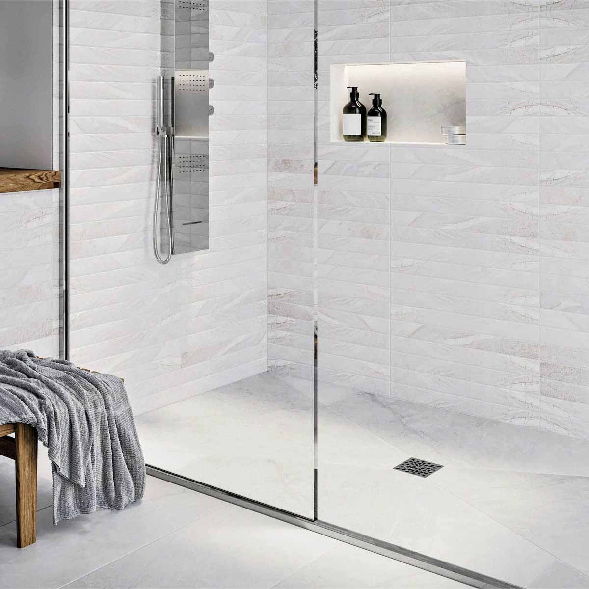 Modern bathroom with glass shower enclosure, White wall tiles, and Polished Chrome fixtures with Ebbe Drains Unique Square Shower Drain Grate - Splash