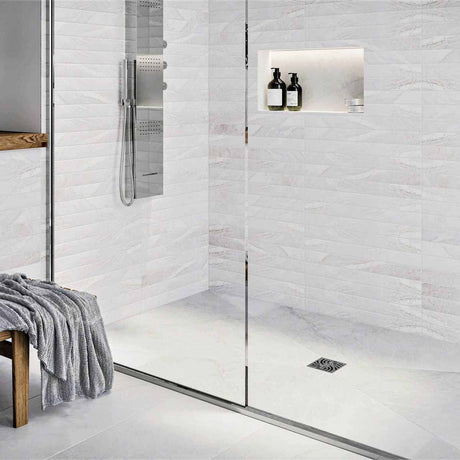 Modern bathroom with glass shower enclosure, White wall tiles, and Polished Chrome fixtures with Ebbe Drains Unique Square Shower Drain Grate - Twister