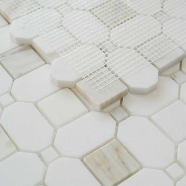 Honed marble mosaic backsplash tile with white and gold veining