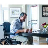Floor to ceiling transfer pole installed beside bed for safe mobility assistance