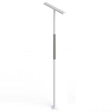 Mobility assistance pole with rotating support arm in residential bedroom