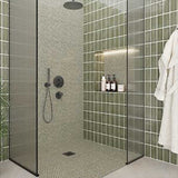 Handmade olive green wall tile creating a sophisticated feature in shower and bathroom spaces