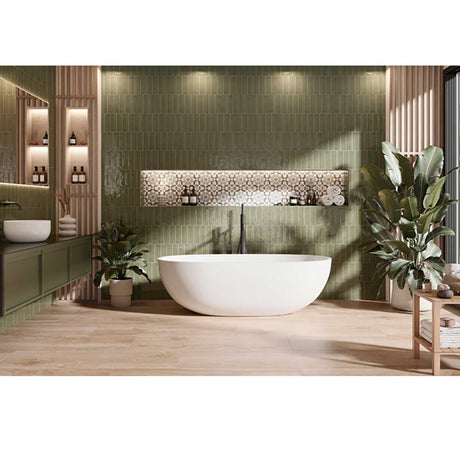 Handmade olive green wall tile creating a refined feature in shower and bathroom spaces