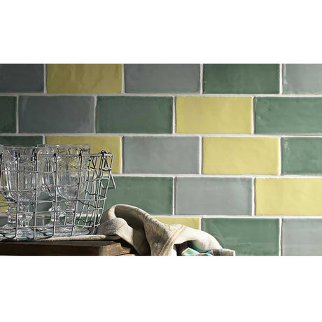 Green ceramic backsplash tile bringing natural color and style to a modern kitchen