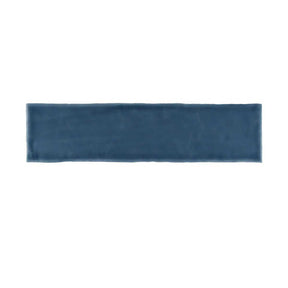 Glossy blue ceramic subway tile with handcrafted Spanish artisan character