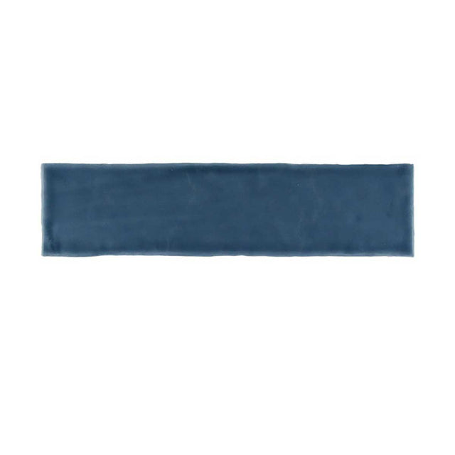 Glossy blue ceramic subway tile with handcrafted Spanish artisan character