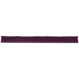 Glossy blueberry ceramic bullnose trim tile with handcrafted Spanish character