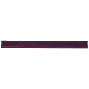 Glossy blueberry ceramic bullnose trim tile with handcrafted Spanish character