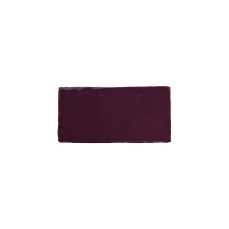 Glossy blueberry ceramic subway tile with handcrafted Spanish artisan detailing