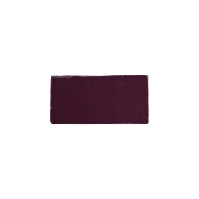 Glossy blueberry ceramic subway tile with handcrafted Spanish artisan detailing