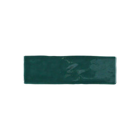 Glossy green ceramic wall tile with artisan-inspired handcrafted texture