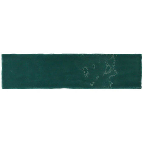 Glossy green ceramic wall tile featuring handcrafted Spanish artistry