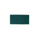 Glossy green ceramic subway tile with handcrafted Spanish character