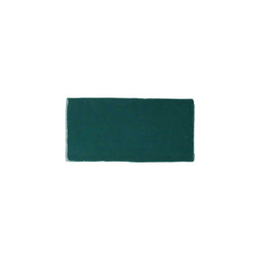 Glossy green ceramic subway tile with handcrafted Spanish character