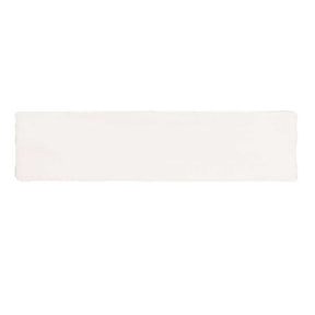 Glossy cream ceramic subway tile with handcrafted Spanish artisan detailing