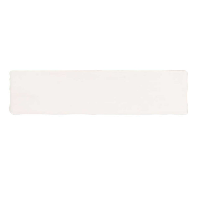 Glossy cream ceramic subway tile with handcrafted Spanish artisan detailing