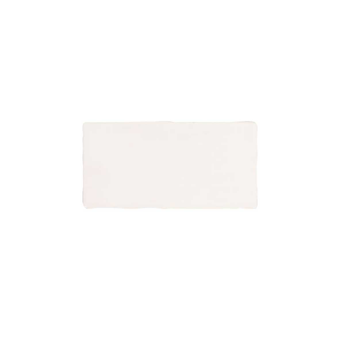 Glossy cream ceramic subway tile featuring handcrafted Spanish artisan texture