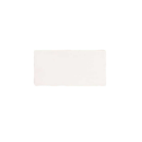 Glossy cream ceramic subway tile featuring handcrafted Spanish artisan texture