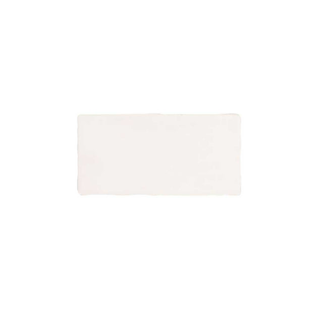 Glossy cream ceramic subway tile featuring handcrafted Spanish artisan texture