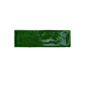Glossy emerald ceramic wall tile with handcrafted Spanish artisan character