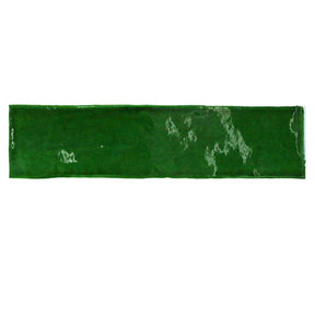 Glossy emerald ceramic subway tile with handcrafted Spanish artisan detailing