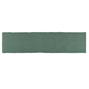 Glossy green ceramic subway tile with handcrafted Spanish artisan detailing