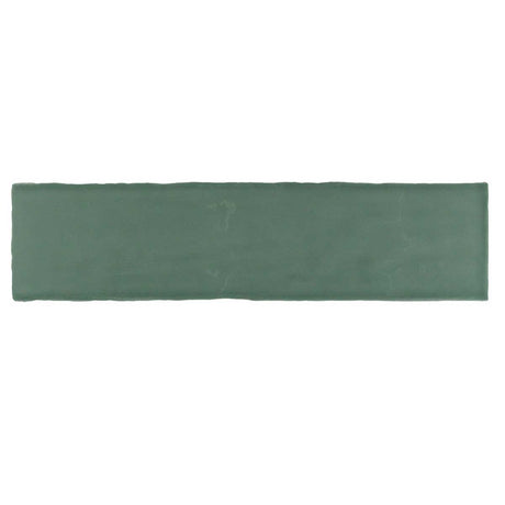 Glossy green ceramic subway tile with handcrafted Spanish artisan detailing