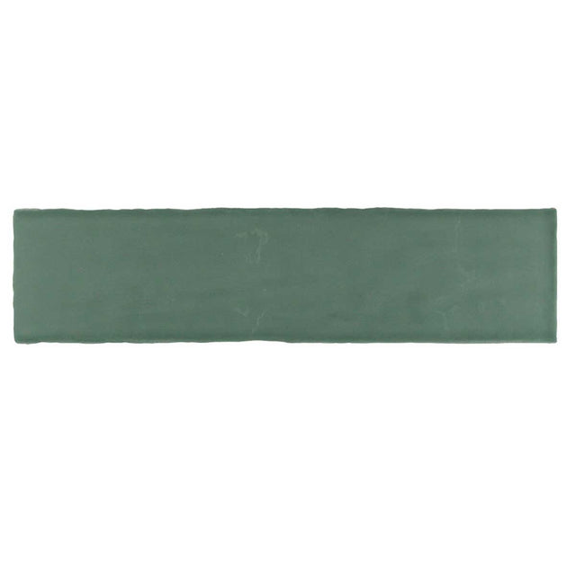 Glossy green ceramic subway tile with handcrafted Spanish artisan detailing