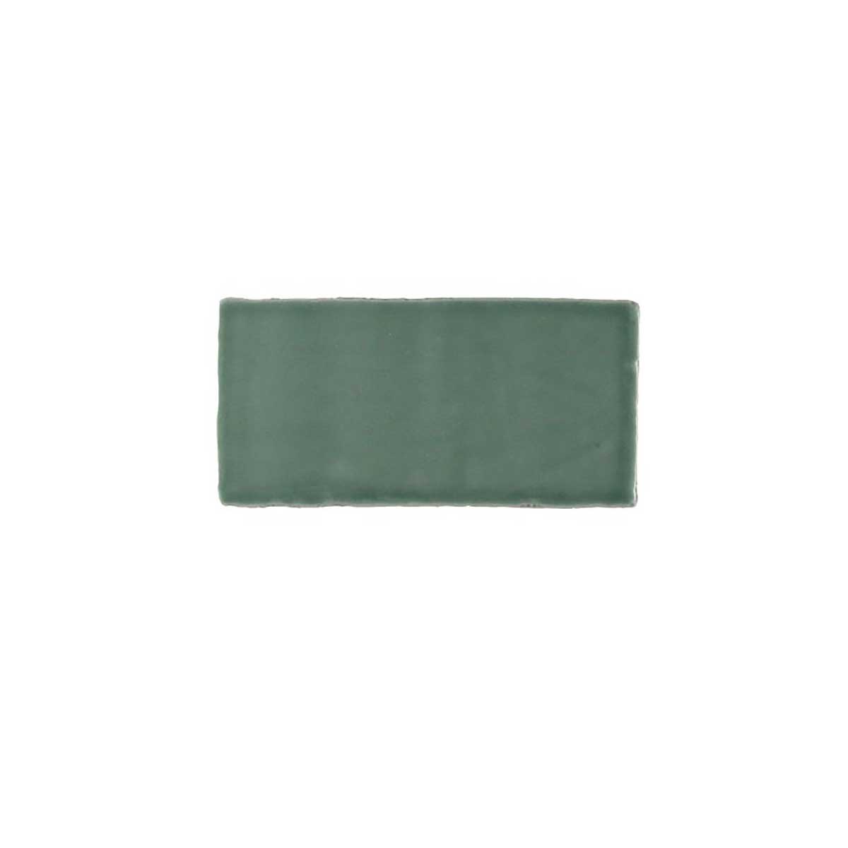 Glossy green ceramic subway tile featuring handcrafted Spanish artisan texture