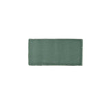Glossy green ceramic subway tile featuring handcrafted Spanish artisan texture