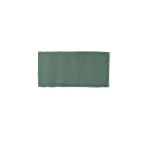 Glossy green ceramic subway tile featuring handcrafted Spanish artisan texture