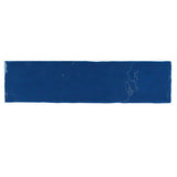 Glossy indigo ceramic subway tile with handcrafted Spanish artisan detailing
