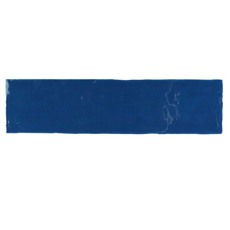 Glossy indigo ceramic subway tile with handcrafted Spanish artisan detailing