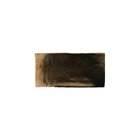 Metallic gold ceramic subway tile with handcrafted Spanish artisan detailing