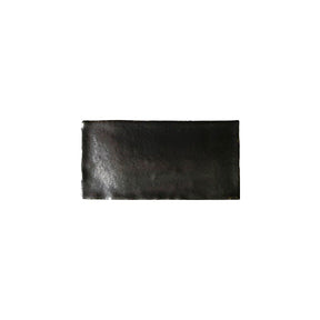 Glossy metallic silver ceramic subway tile with handcrafted Spanish artisan detailing