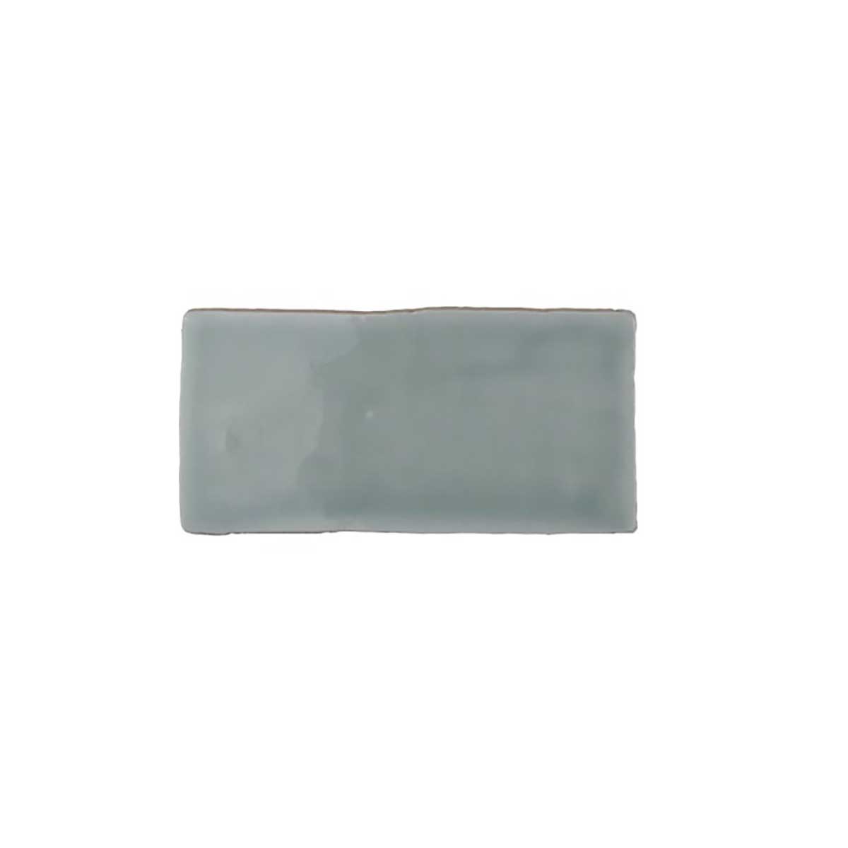 Glossy mint ceramic subway tile featuring handcrafted Spanish artisan texture