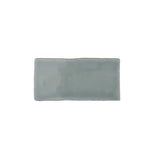 Glossy mint ceramic subway tile featuring handcrafted Spanish artisan texture