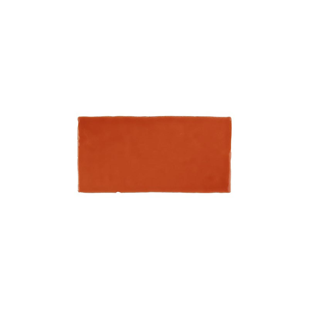 Glossy orange ceramic subway tile with handcrafted Spanish artisan detailing