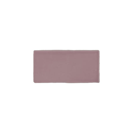 Glossy pink ceramic subway tile with handcrafted Spanish artisan detailing