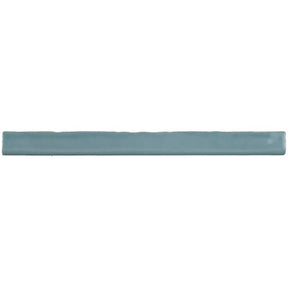 Glossy sky blue ceramic bullnose trim tile with handcrafted Spanish artisan detailing